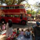 People wave to Unitrans bus in Picnic Day parade