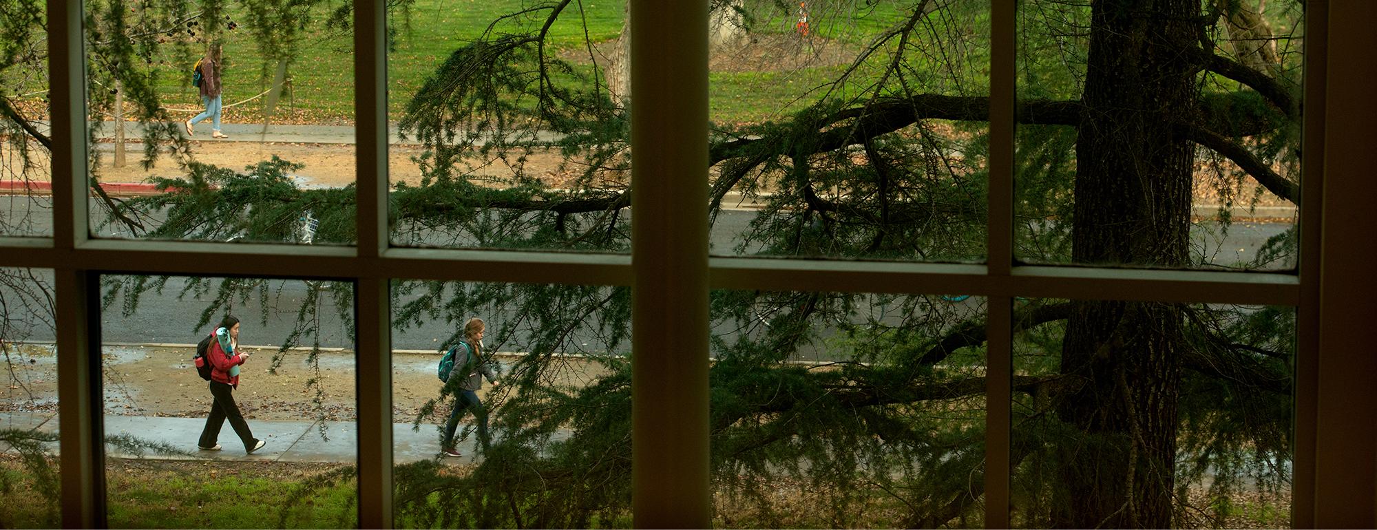 student walks outside uc davis classroom