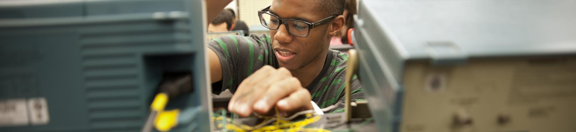 uc davis applied physics student works with circuits