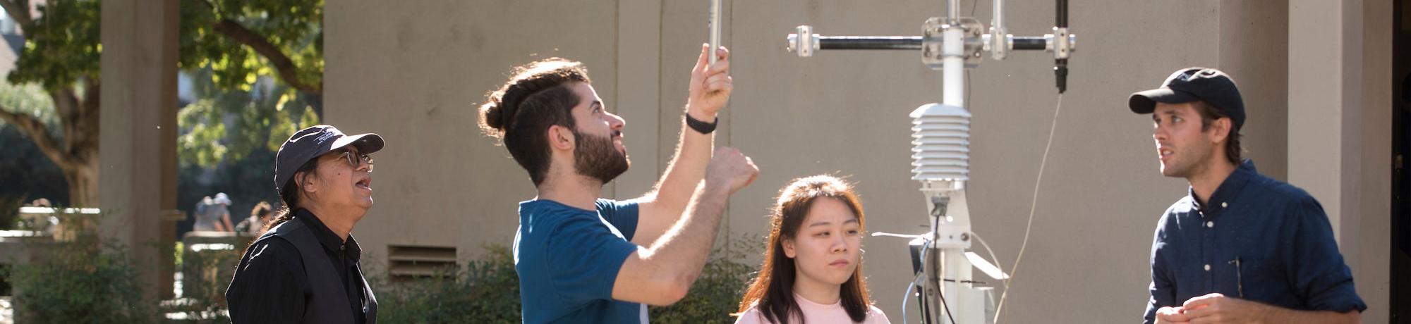 Students working with weather instruments