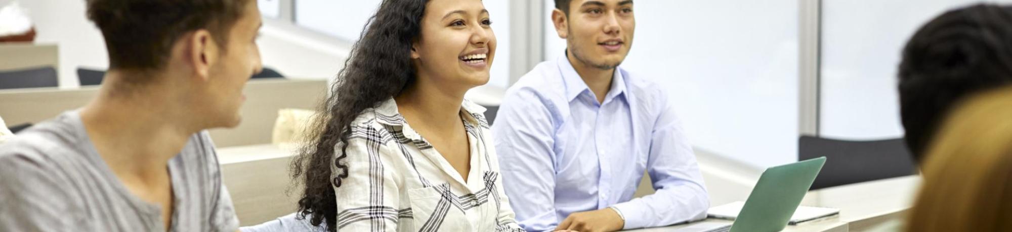 students listening to a presentation in a classroom