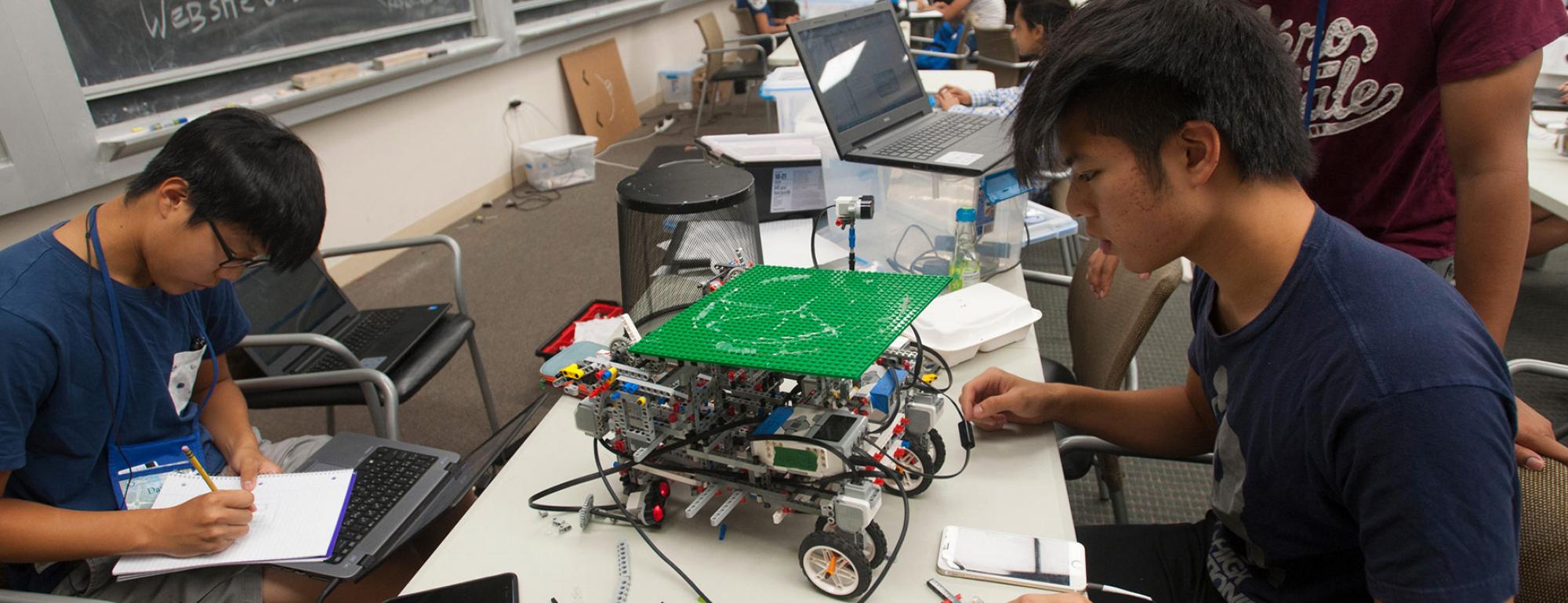 two students working on an engineering project