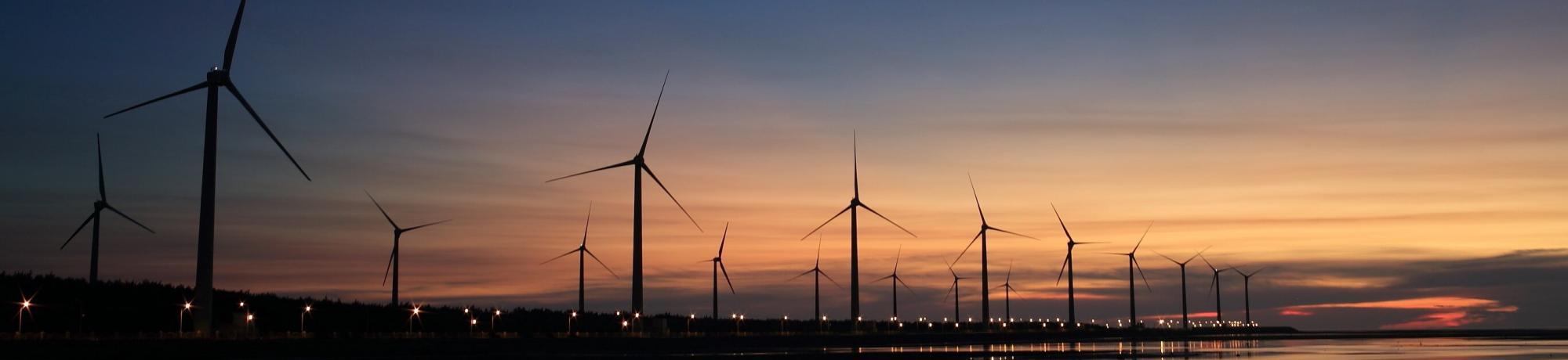 wind turbines at sunset