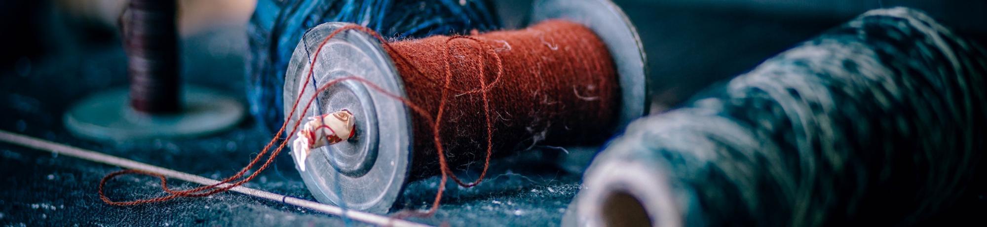 zoomed in image of spools of yarn