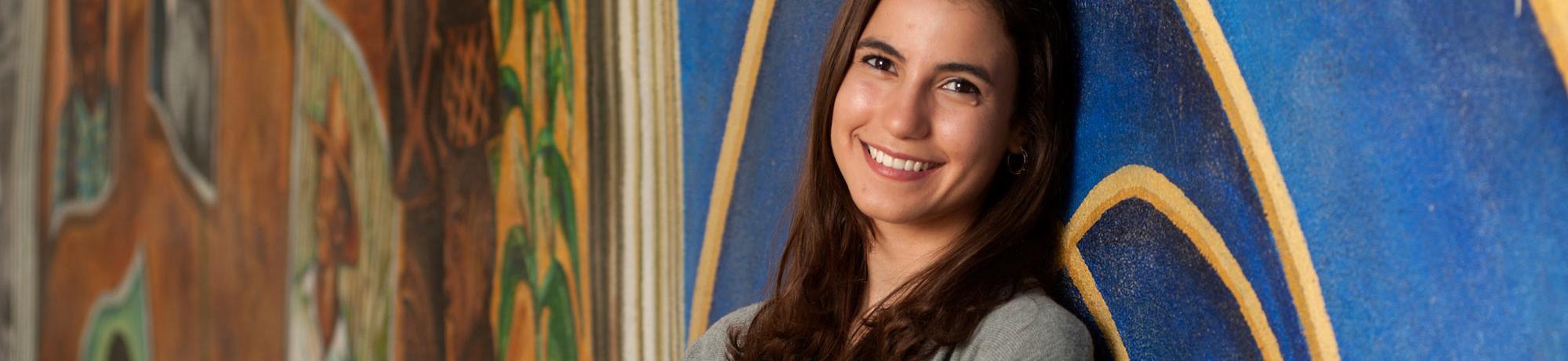 A female student poses for the camera