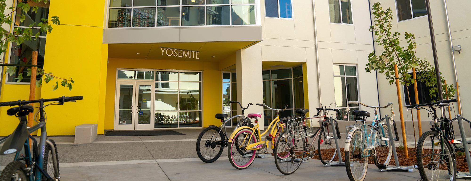 A view of a bike parking area just outside the entrance to Yosemite hall 