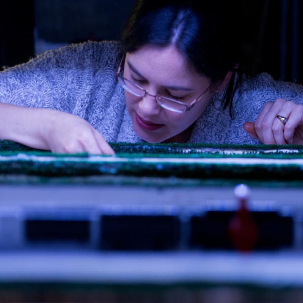 A female UC Davis grad student investigates some biological specimens