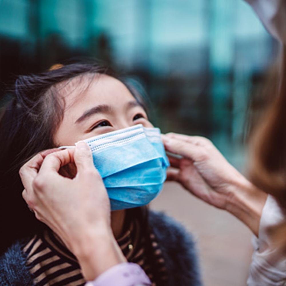 young girl gets a face mask