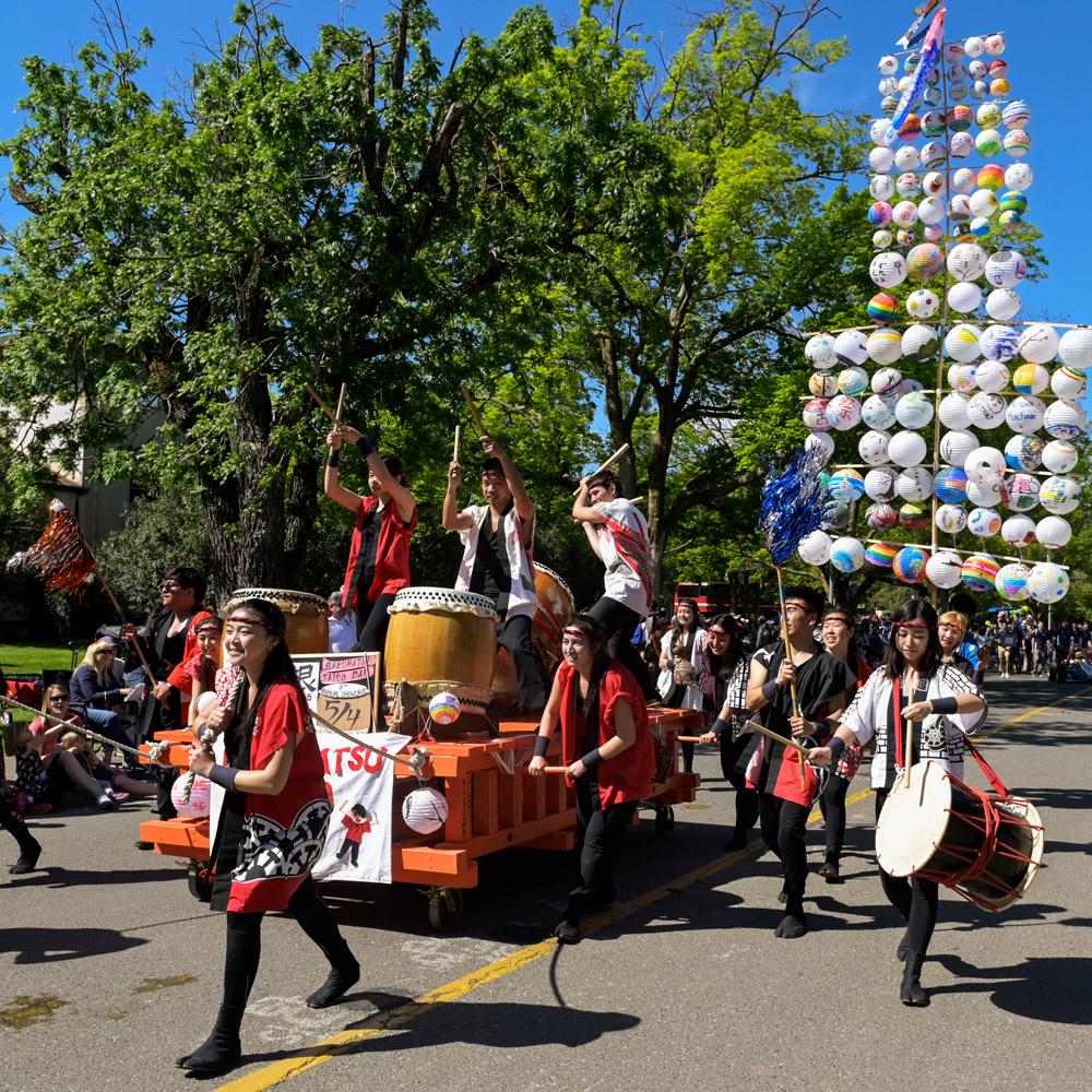 a band marching down the street during the Picnic Day parade