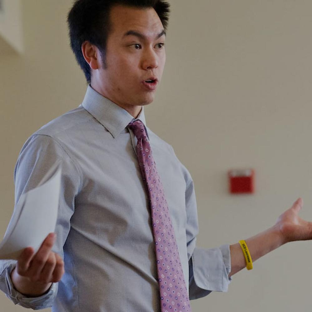 A UC Davis MBA student speaks with his peers
