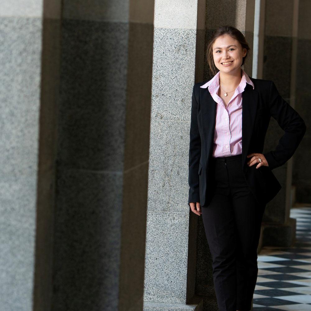 A UC Davis student poses at the capitol building in Sacramento