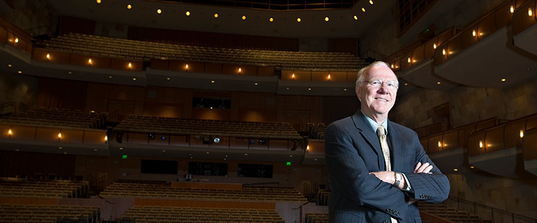 Larry Vanderhoef standing in the Mondavi Center performance hall