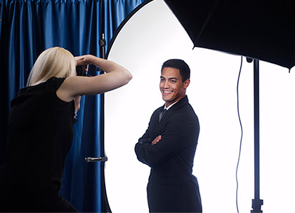 Man getting his taken by a professional female photographer