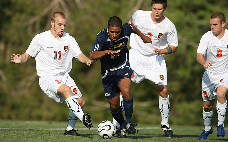 Several soccer players playing hard