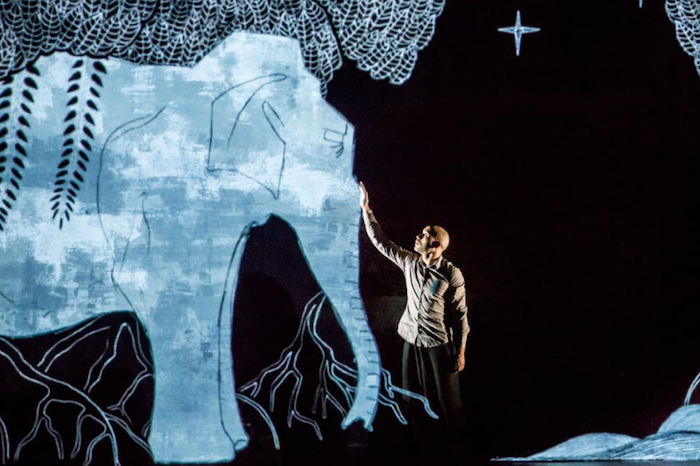 Akram Khan performing on stage.