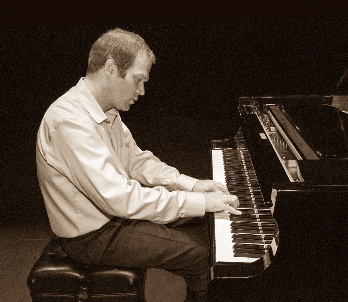 Andrei Baumann playing the piano.