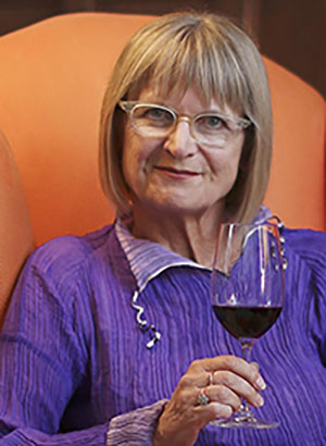 Jancis Robinson holds a glass of wine