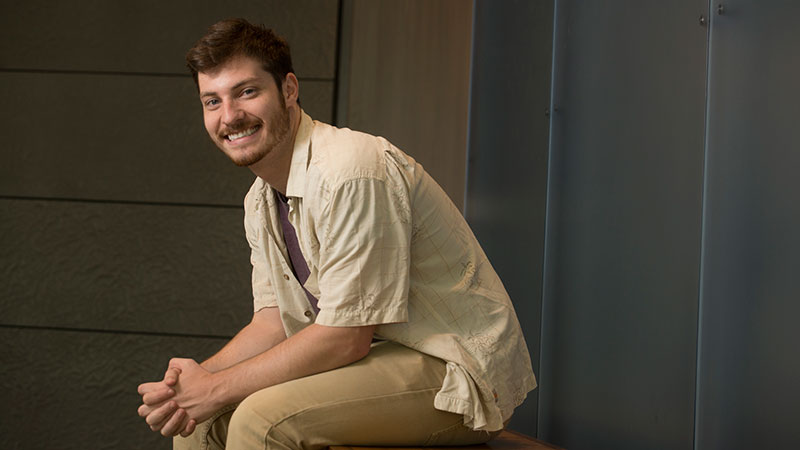A male student sits