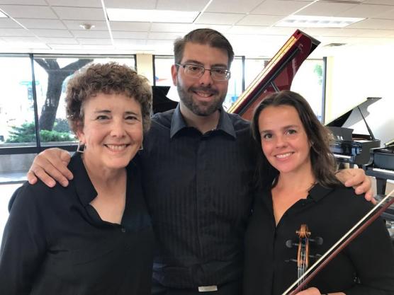 The members of Trio Foss holding their instruments.